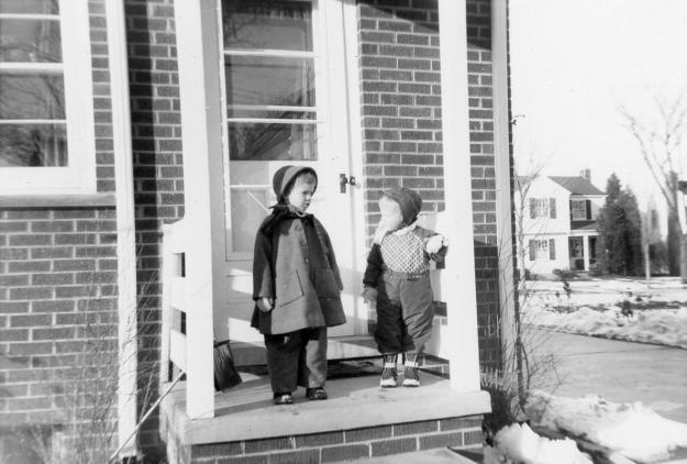 Hess girls in snow suits on the back porch of Harbrooke 1956